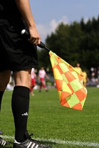 Sideline referee with flag